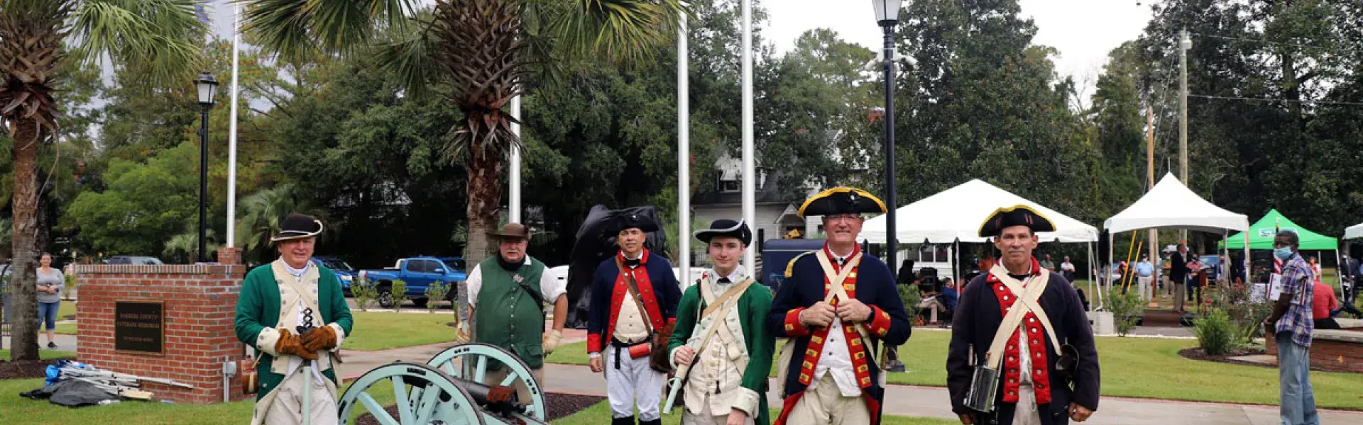 Men in historical military uniforms at a Battleground Trust commemorative site